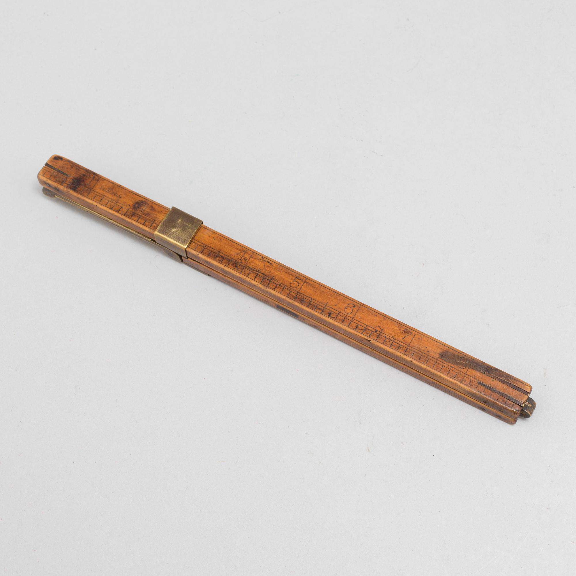 A 19th century wooden measuring stick.