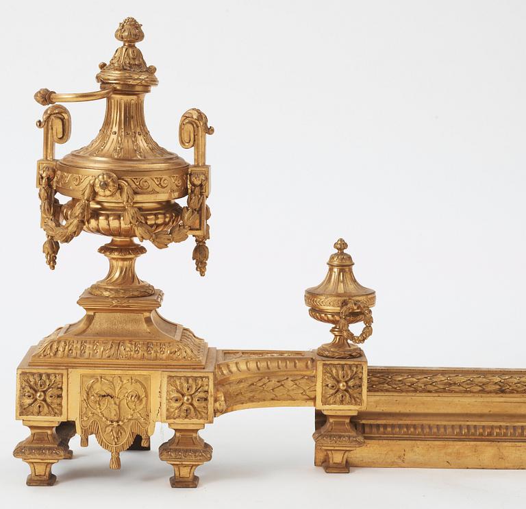 A pair of French Louis XVI-style 19th century gilt bronze fire dogs.