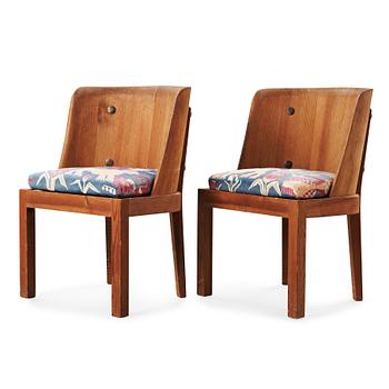 A pair of Axel Einar Hjorth 'Lovö' stained pine armchairs, Nordiska Kompaniet, Sweden 1930's.