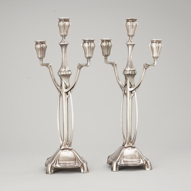 A pair of WMF Art Nouveau silver plated pewter candelabra, Germany.