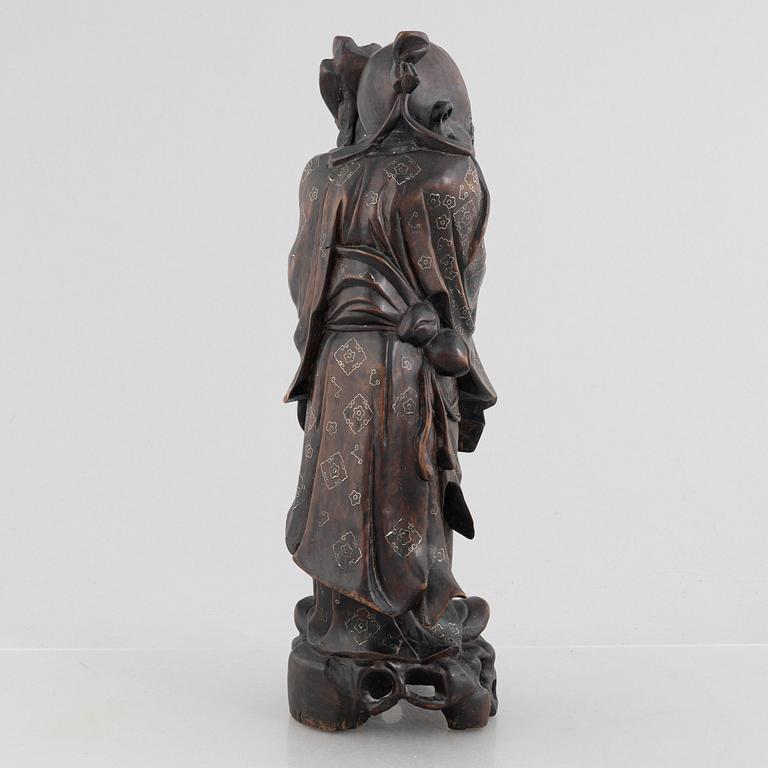 A Chinese wooden figure of 'Shoulao' with silver inlays, 20th century.