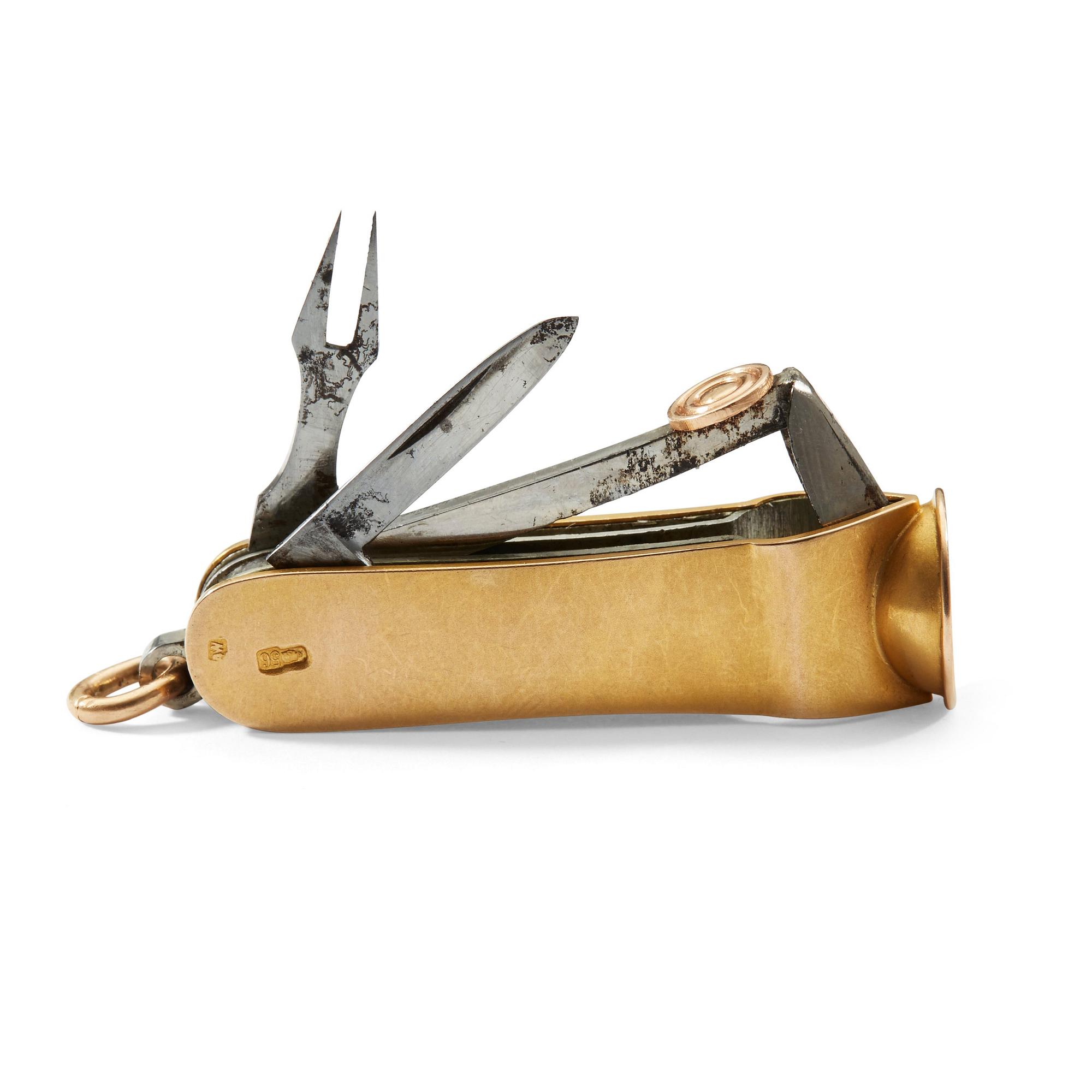 A Russian 20th century gold and metal cigar-cutter, unidentified makers mark, St. Petersburg 1908-1917.