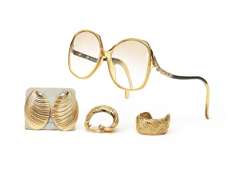An early 1980s set of glasses and two pairs of earrings by Christian Dior/Yves Saint Laurent.