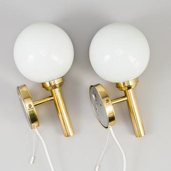 A pair of 20th century brass wall lights by Abo Denmark.
