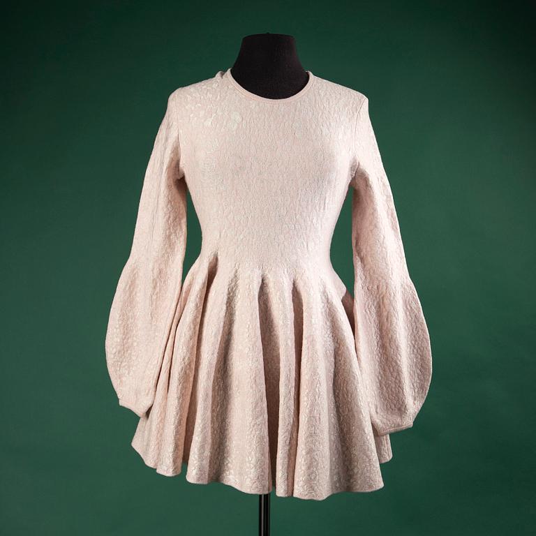 A dress by  ALEXANDER McQUEEN, size L.