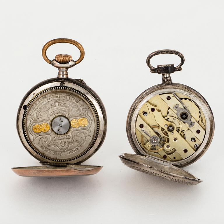 TWO POCKET WATCHES WITH STANDS.