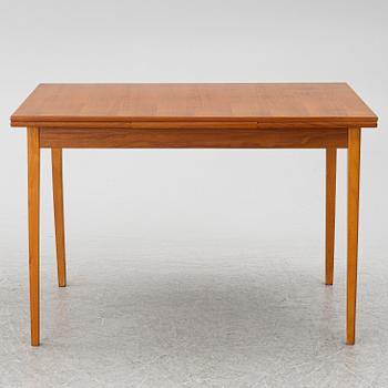 A mid20th century dining table.