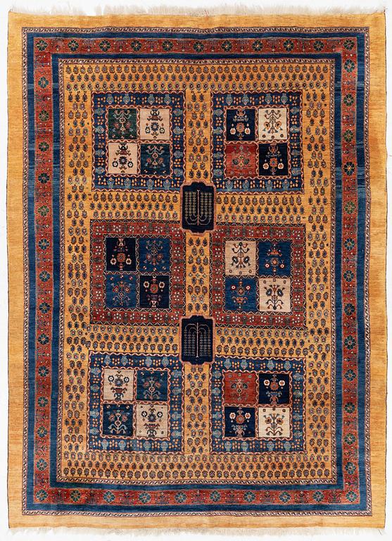 An oriental 'garden' carpet of Safavid design probably from the Shiraz area, Iran, c 343 x 254 cm.