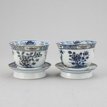 A pair of blue and white cups with stands, late Qing dynasty.