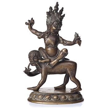 656. A Tibeto-Chinese bronze figure of a Rakshasi, ca 1900.