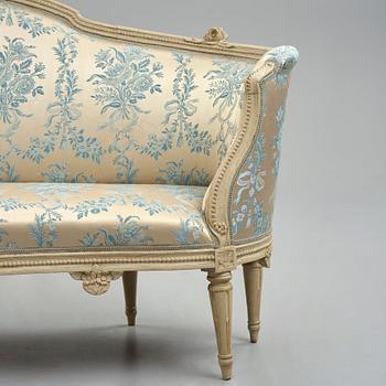 A grey-painted Gustavian 'canapé en corbeille'. sofa, by J E Höglander.