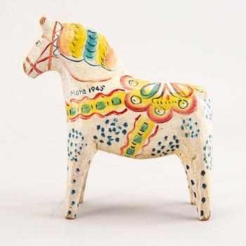 A Swedish painted and dated 1945 wooden horse.