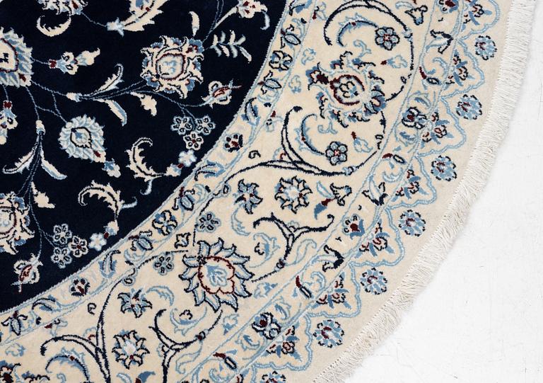 A Nain rug, diameter 243 cm.