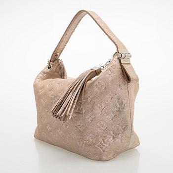 Louis Vuitton, a shimmer 'Halo' bag.