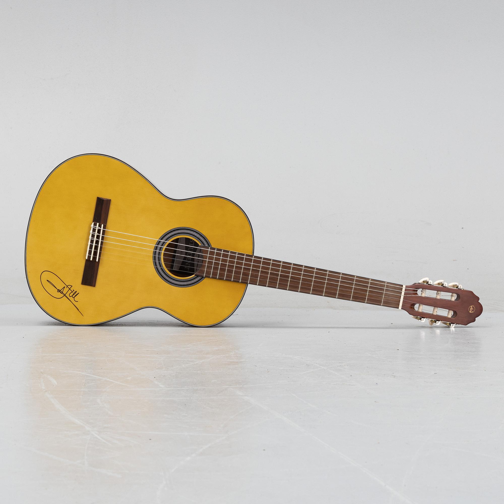 Jill Johnson, a signed acoustic guitar.