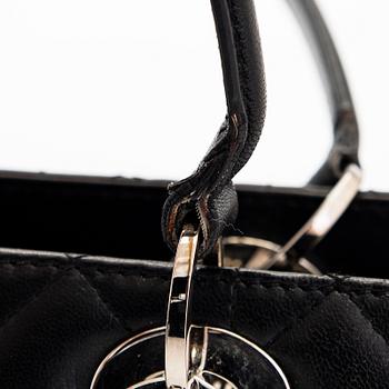 Christian Dior, a 'Lady Dior East West' bag.