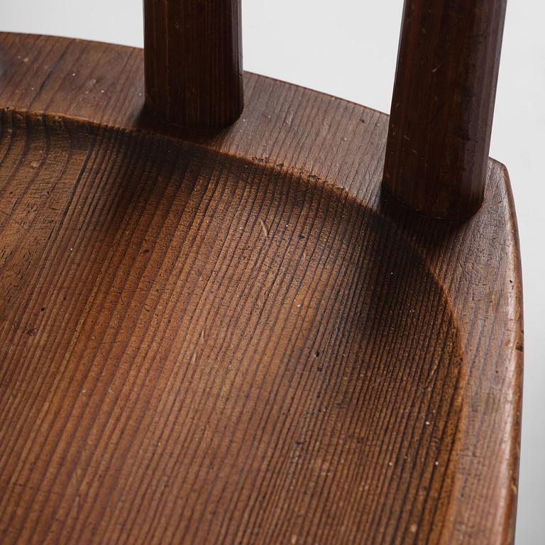 Axel Einar Hjorth, a set of four stained pine "Utö" chairs, Nordiska Kompaniet, Sweden, 1930s.