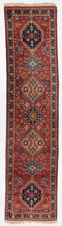 A semi-antique Kurdish runner, 350 x 140 cm.