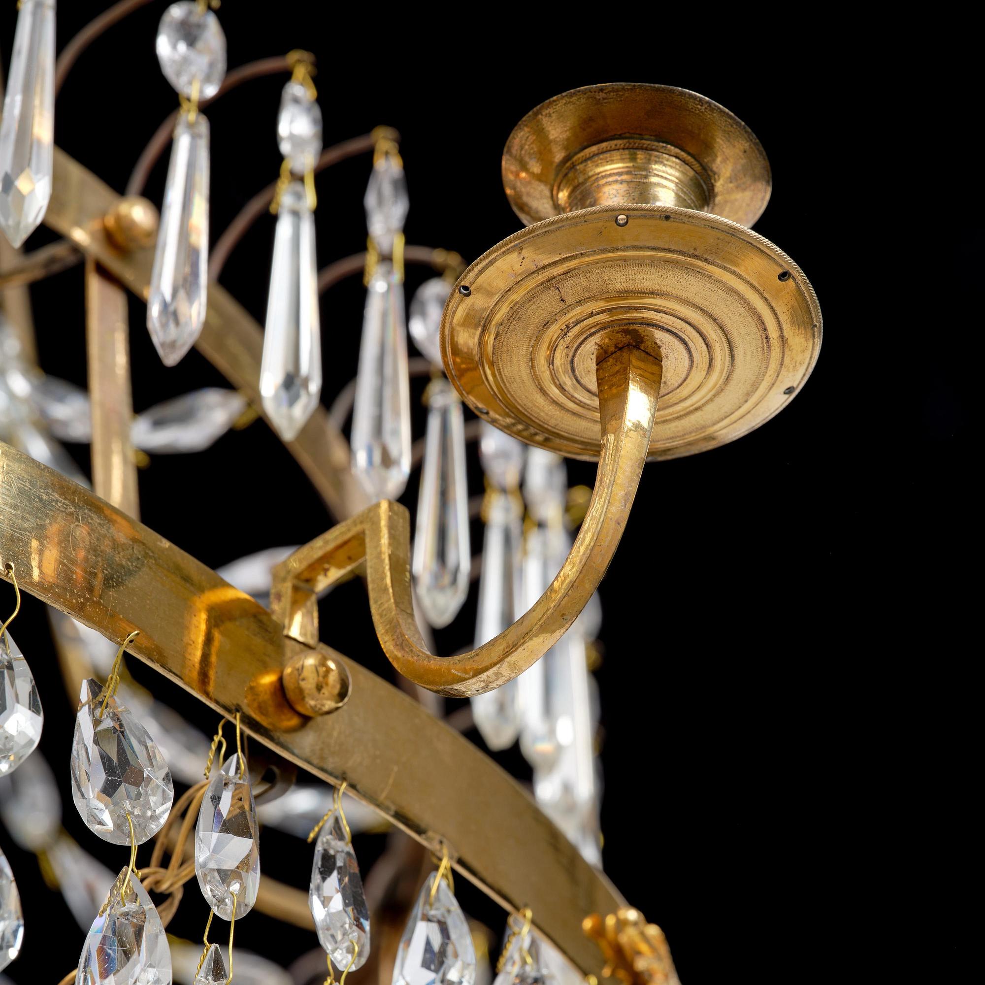 A late Gustavian gilt brass and cut glass seven-light chandelier, Stockholm, late 18th century.