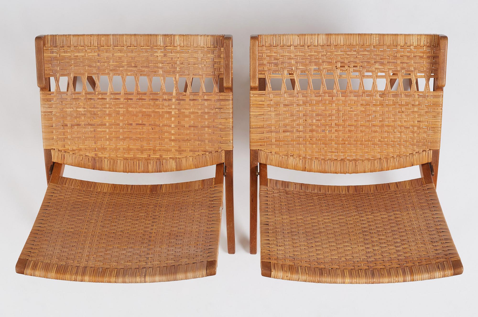 Hans J. Wegner, a pair of oak and rattan folding chairs 'JH-512', Johannes Hansen, Denmark 1950-60s.