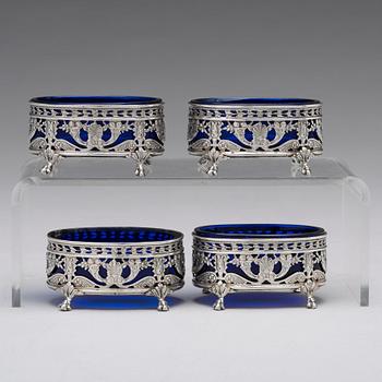 A Belgian set of four 19th century silver and glass salts, marks are Hanau Pseudo marks of "Wolf & Knell", after 1887.