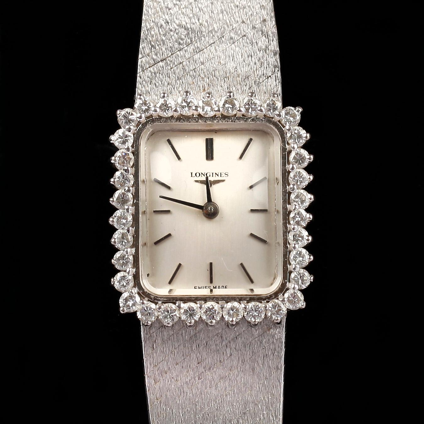 ARMBANDSUR, 18k vitguld med briljantslipade diamanter ca 0,60 ct. "Longines", cikt tot ca 42 g.