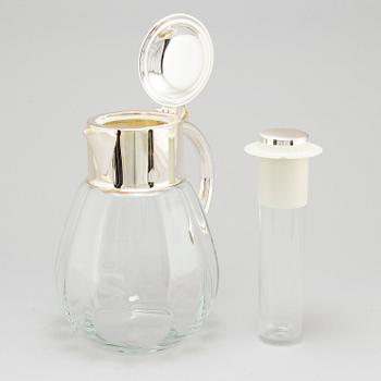 A glass and metal jug, second half of the 20th century, purchased from Firma Svenskt Tenn.