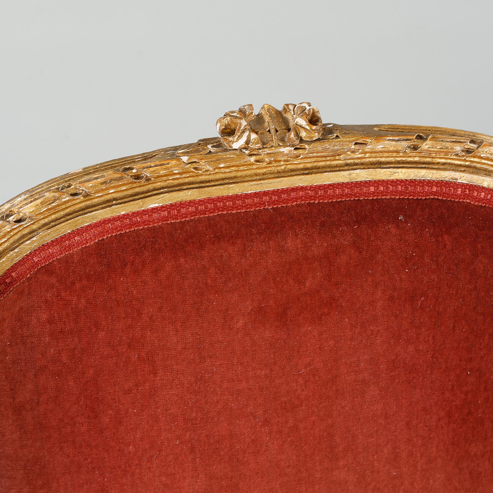 A pair of lounge chairs from the first half of the 20th century.