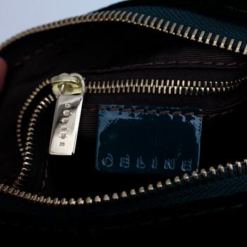 CÉLINE, a green velvet handbag.
