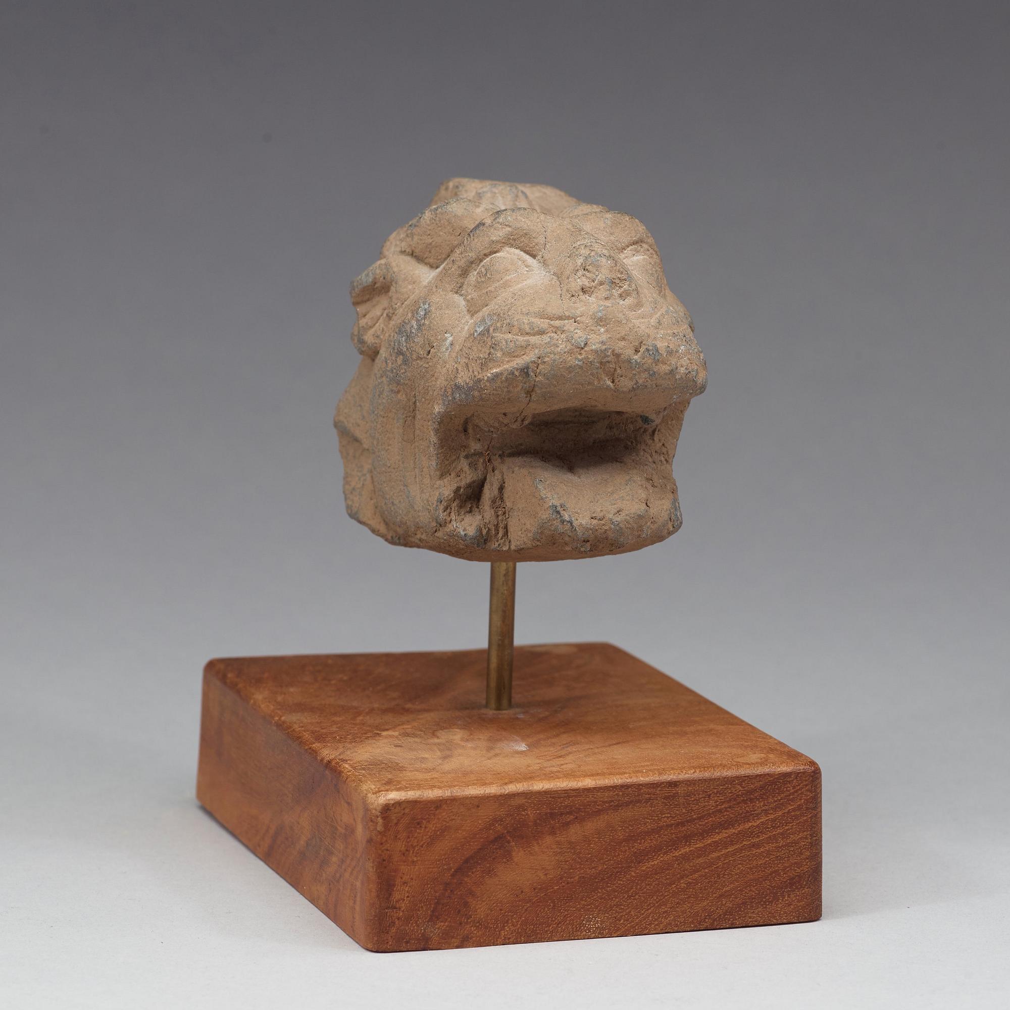 A schist sculpture fragment of a lion, Gandhara, 2nd-3rd Century.