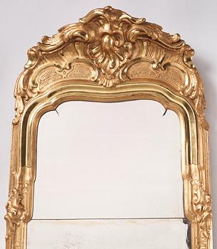 A Swedish rococo giltwood mirror, later part of the 18th century.