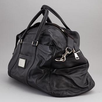 DOLCE & GABBANA, a black leather weekend bag, 2009.