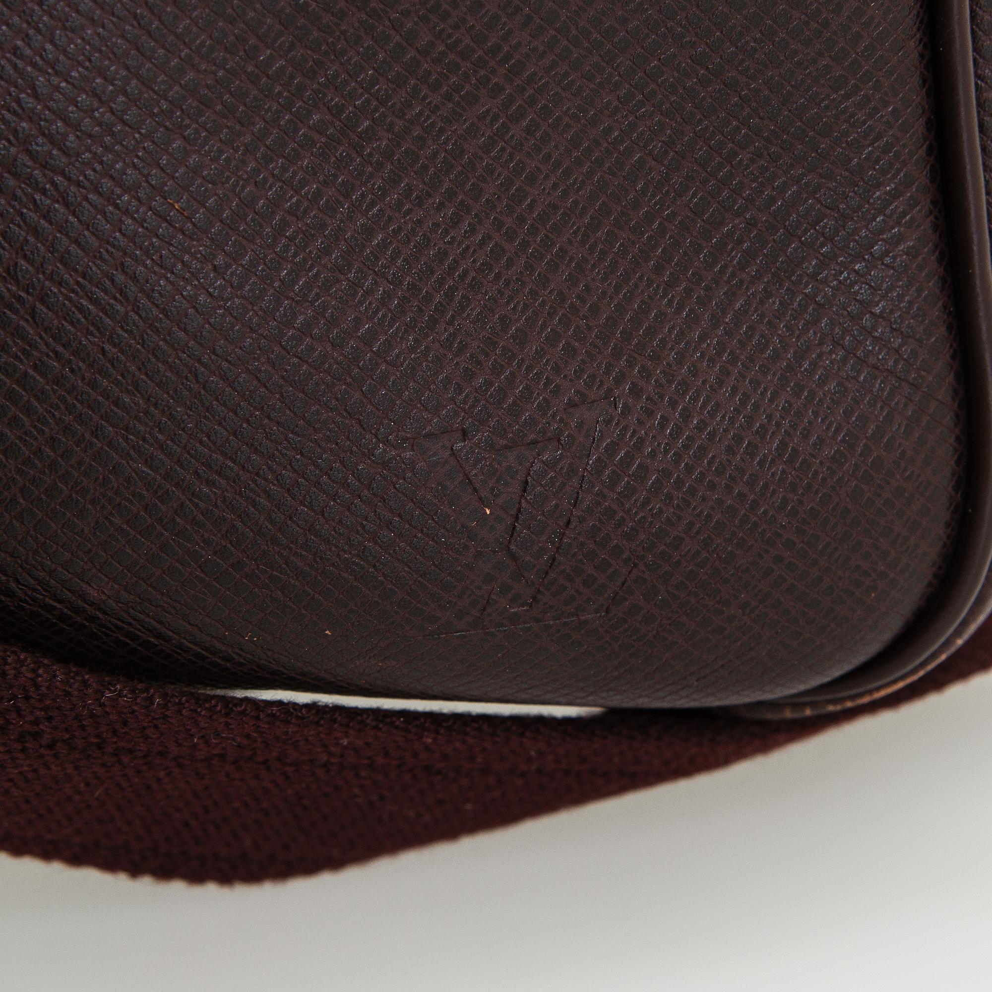 Louis Vuitton, a 'Taiga Kendall PM' weekend bag.