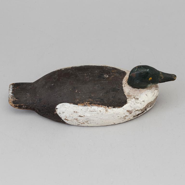 A duck hunt wood decoy circa 1900.
