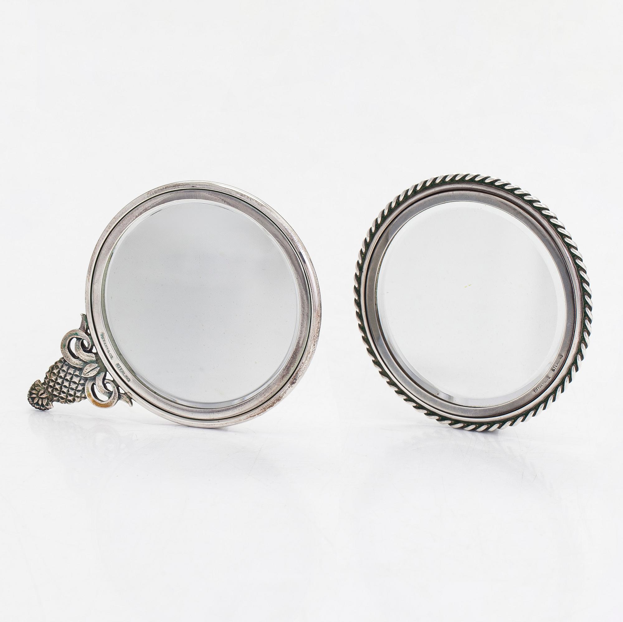 Tiffany & Co, two sterling silver hand mirrors.