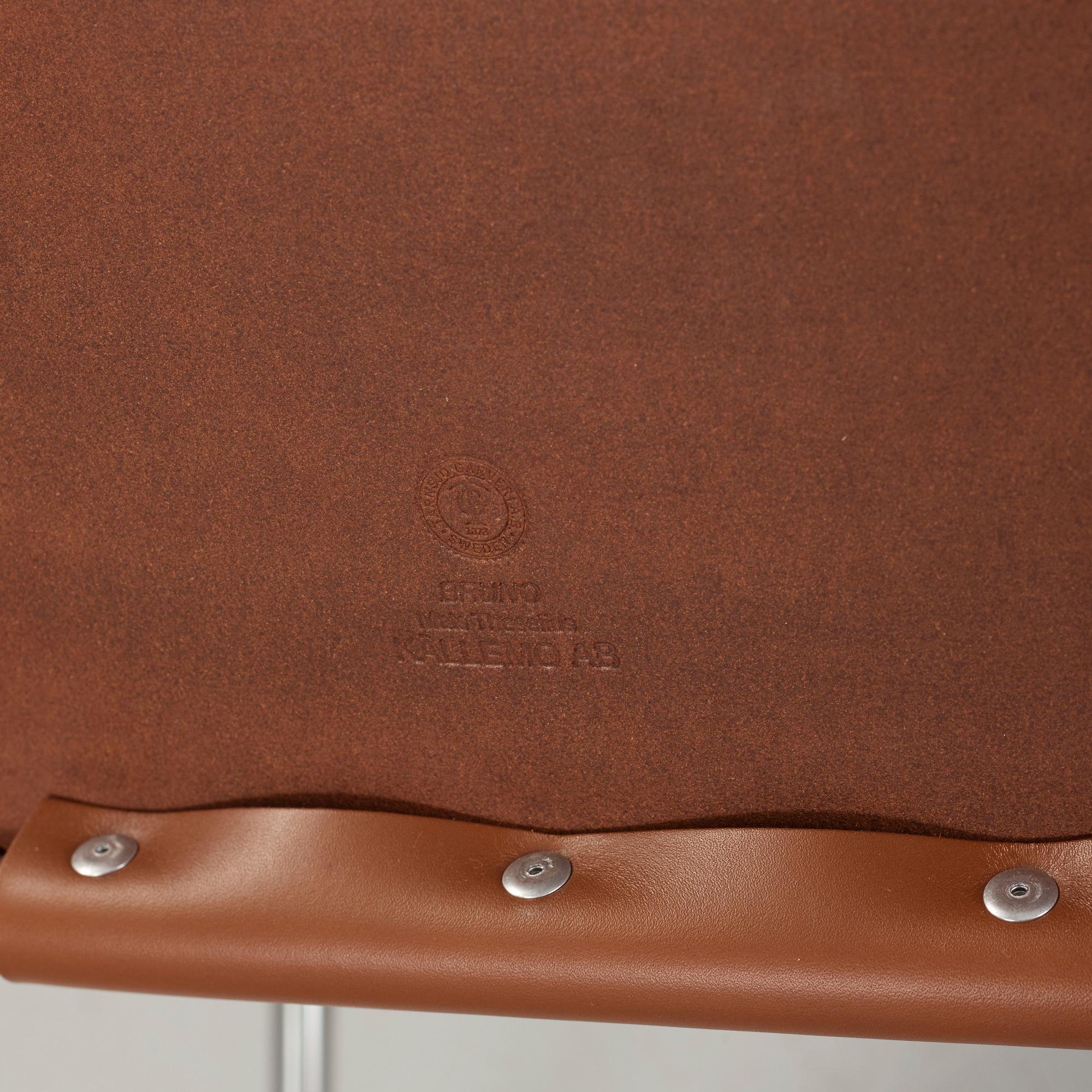 Mats Theselius, A pair of 'Bruno' brown leather and steel easy chairs, Källemo, Sweden.