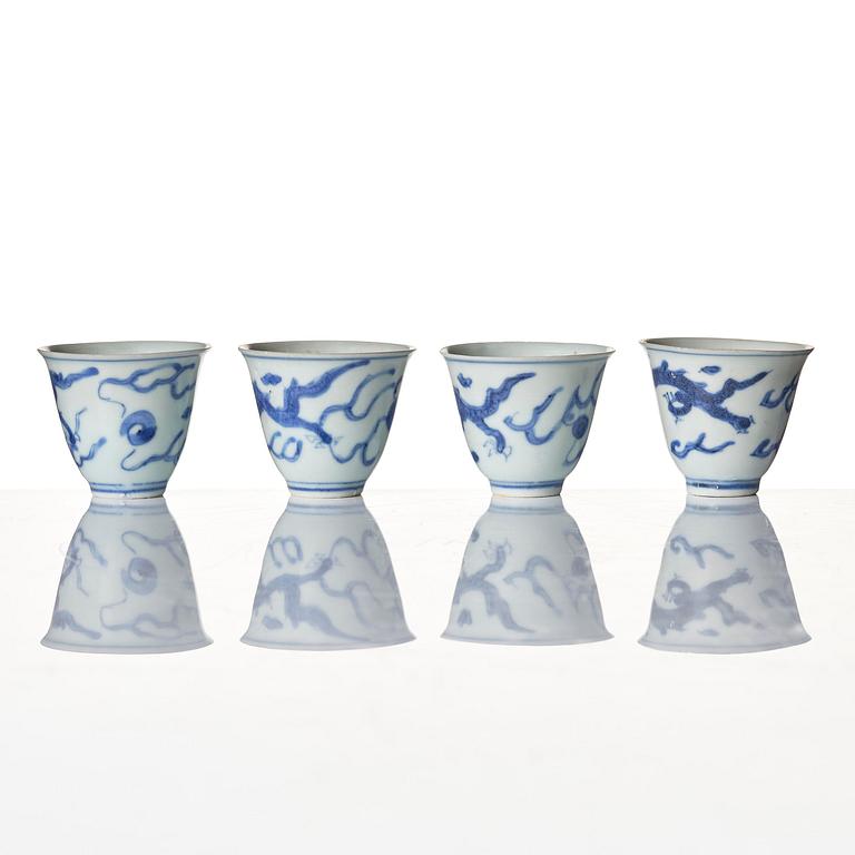A set of four blue and white dragon wine cups, 'Hatcher Cargo', 17th century.