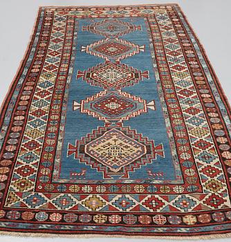 A RUNNER, a semi-antique Caucasian, ca 303,5 x 129,5-140,5 cm (as well as one end with 2,5 cm flat weave).