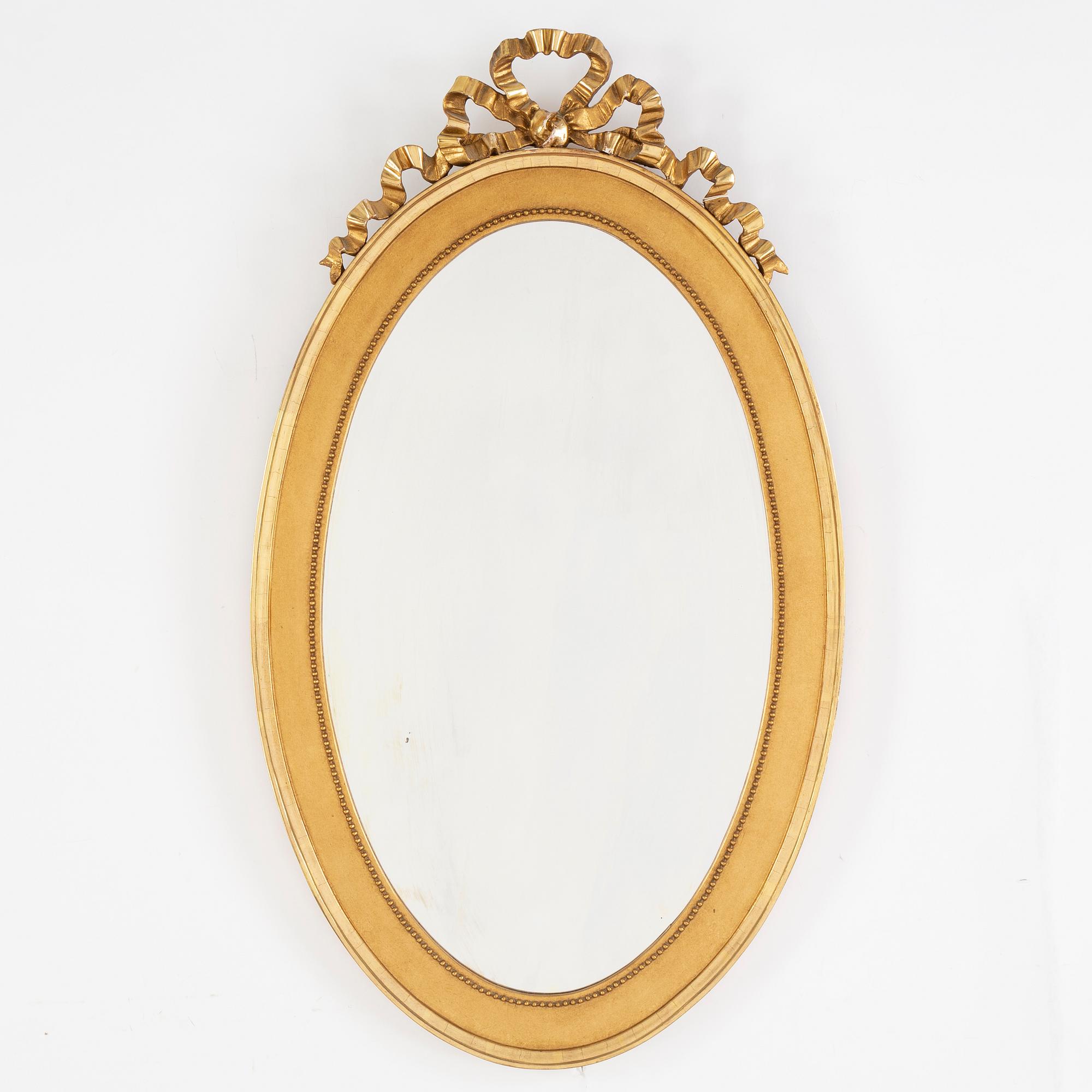 A Gustavian style mirror, mid 20th Century.