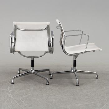 A pair of 'EA 108' desk chairs by Charles & Ray Eames for Vitra.