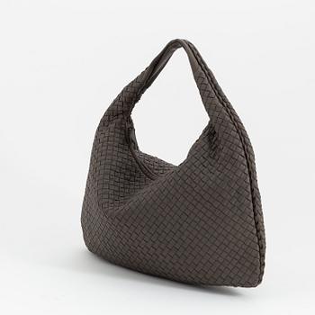 Bottega Veneta, a grey intrecciato leather bag.