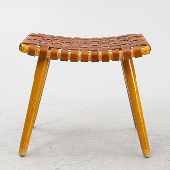 A mid 20th century birch stool with leather.