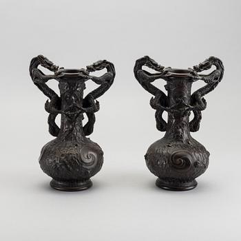 A pair of 20th century bronze vases.