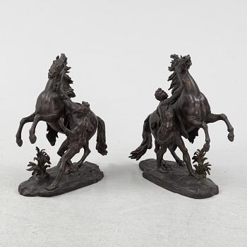 Guilliaume Coustou, after, a pair of bronze sculptures.
