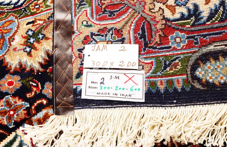 A Kashmar carpet, a. 300 x 200 cm.