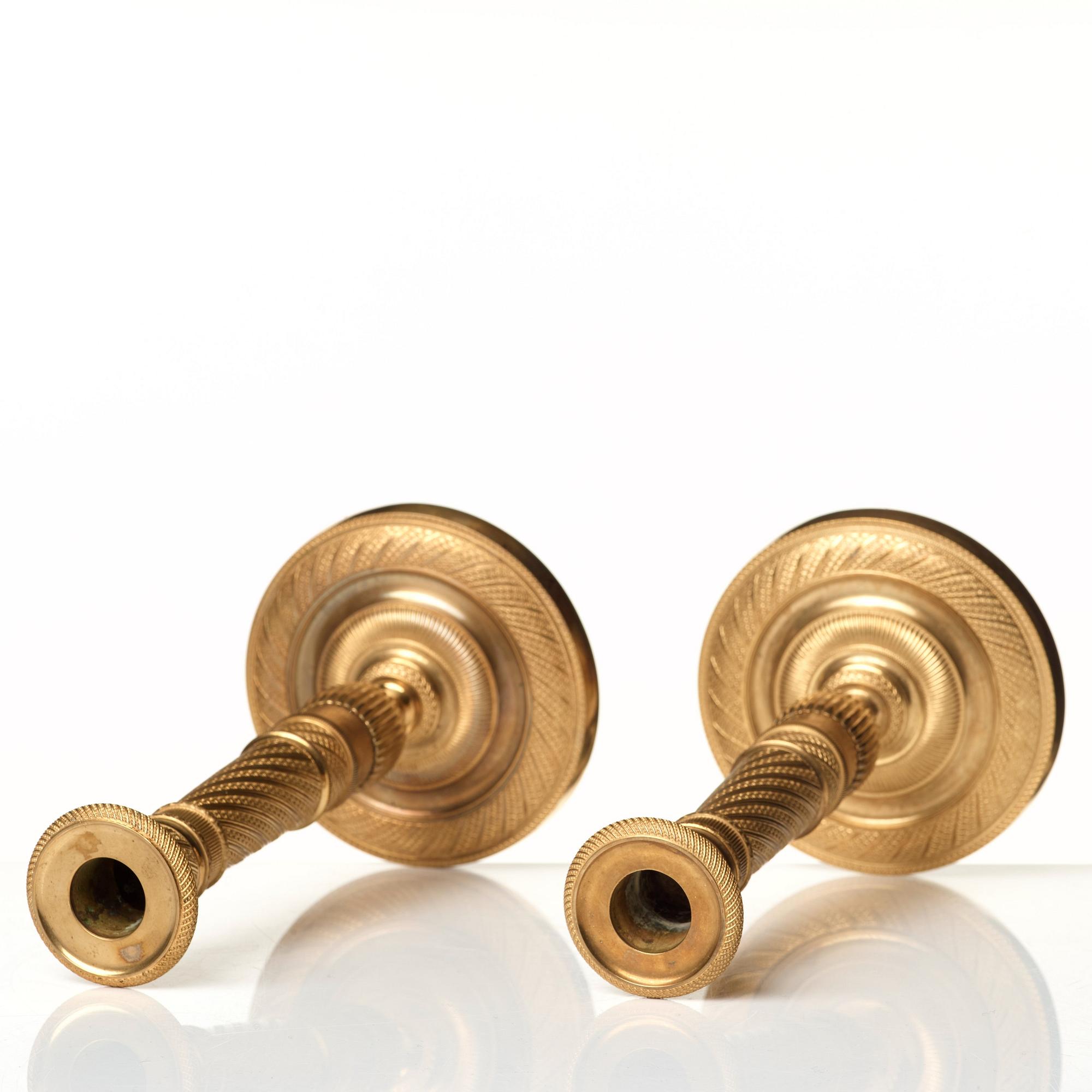 A pair of Empire candlesticks.