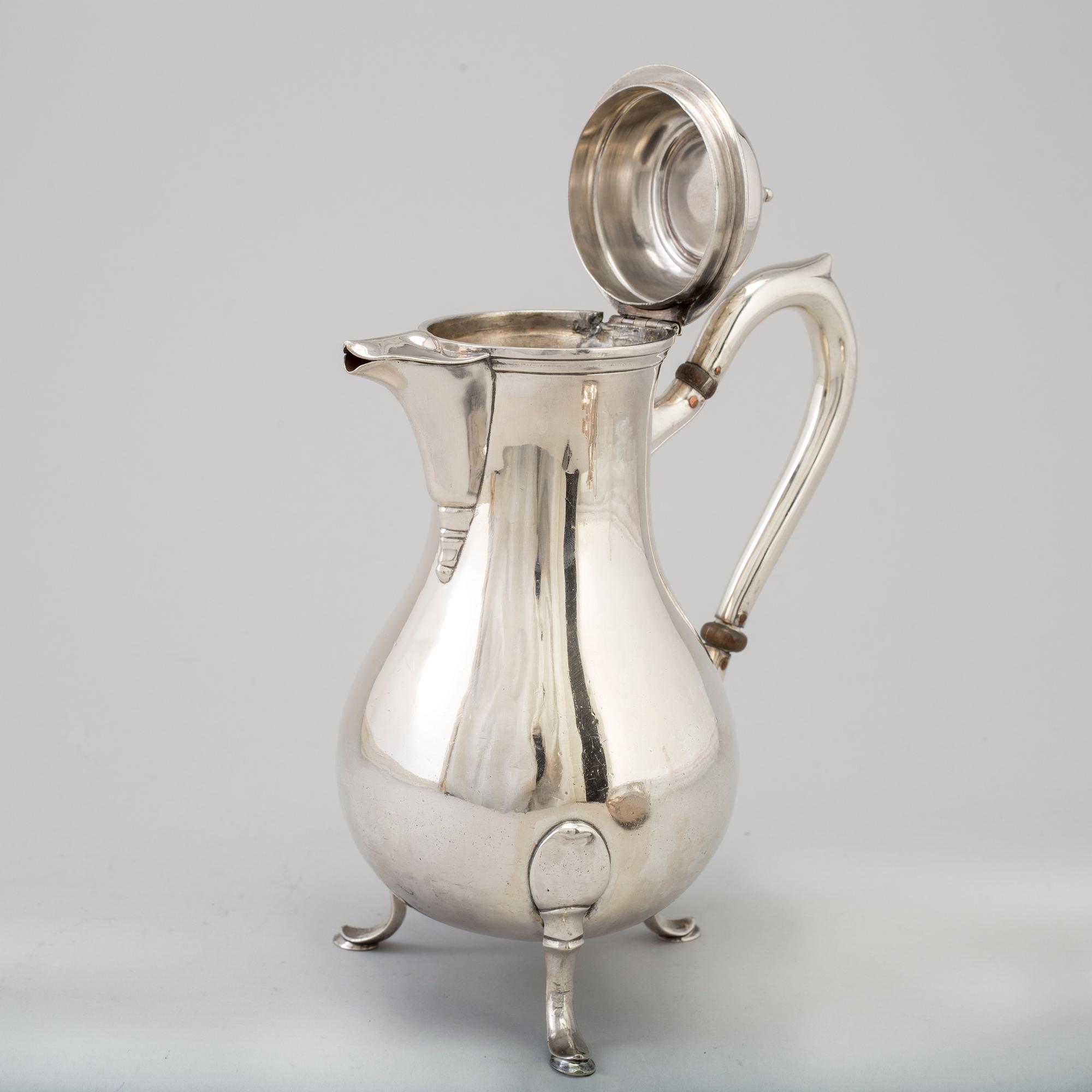A three-piece silver coffee service from Borel & Co, Germany, mid 20th Century.
