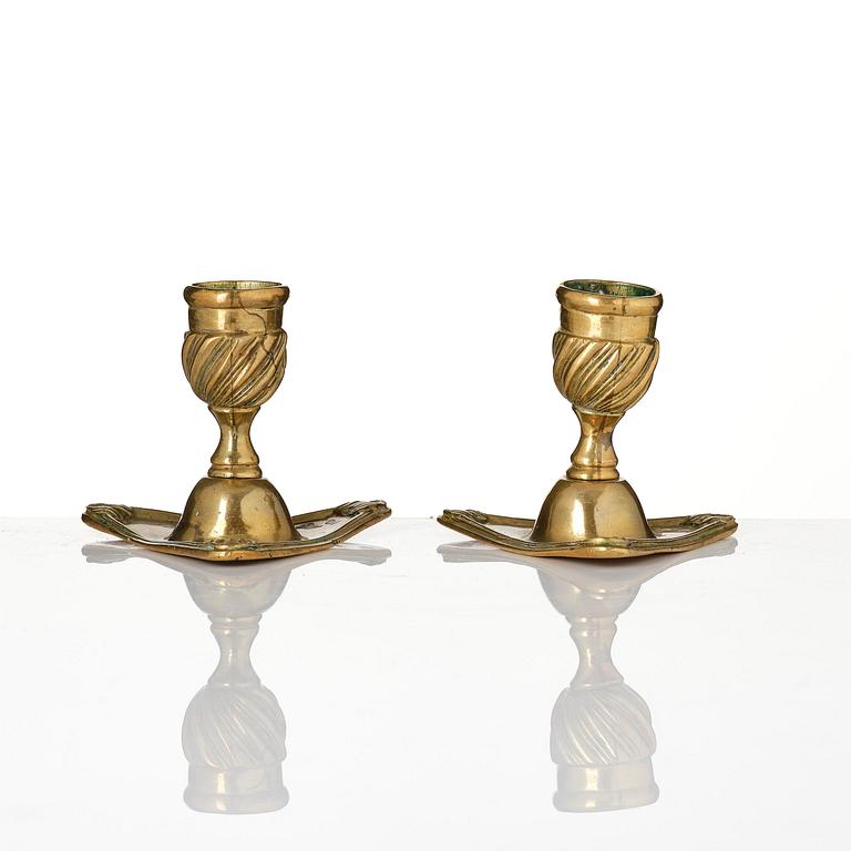 A pair of rococo brass candlesticks by Petter Hemming (master in Stockholm 1771-1807), 1772.