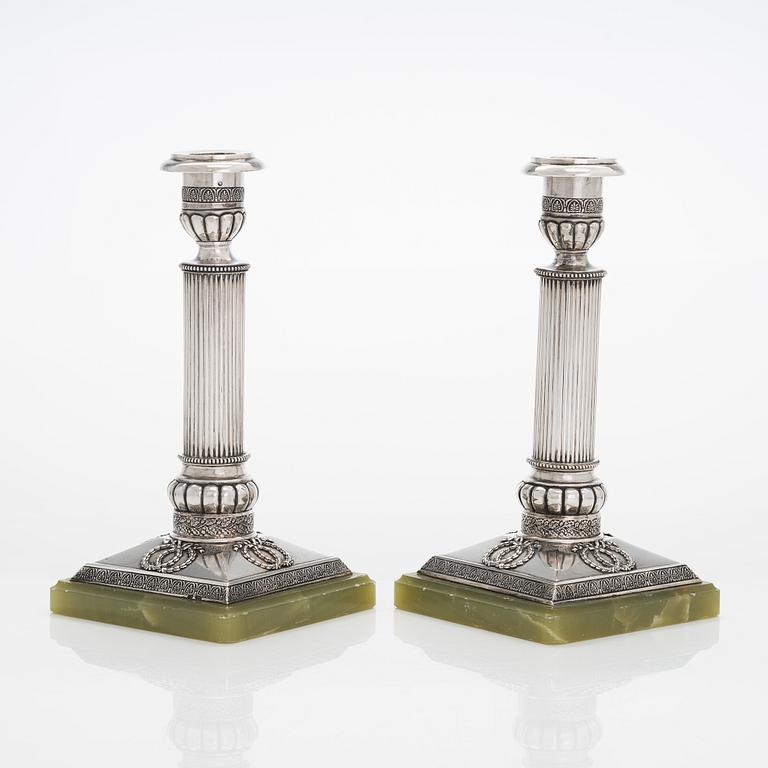 A pair of silver candlesticks, maker's mark A.T., Saint Petersburg 1908-26.