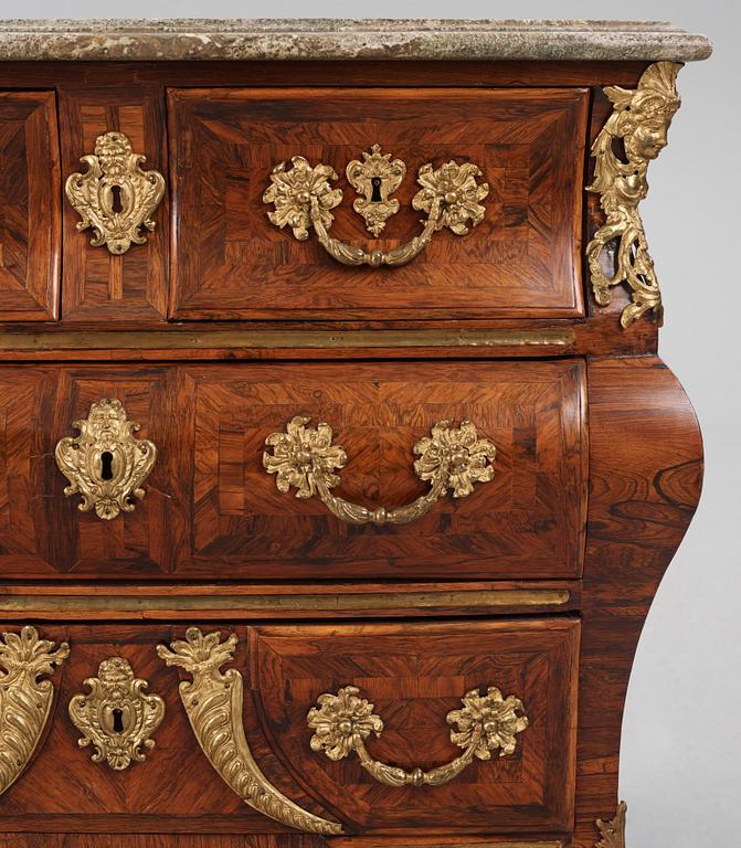A Swedish early rococo parquetry, ormolu-mounted and marble commode, presumably by S. Pasch or J. Wulf , ca. 1740.